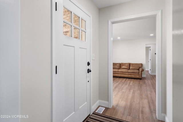 entryway with light hardwood / wood-style flooring