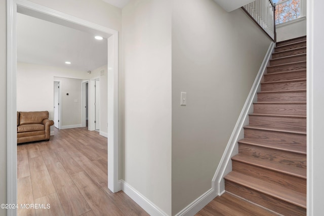 stairs with wood-type flooring