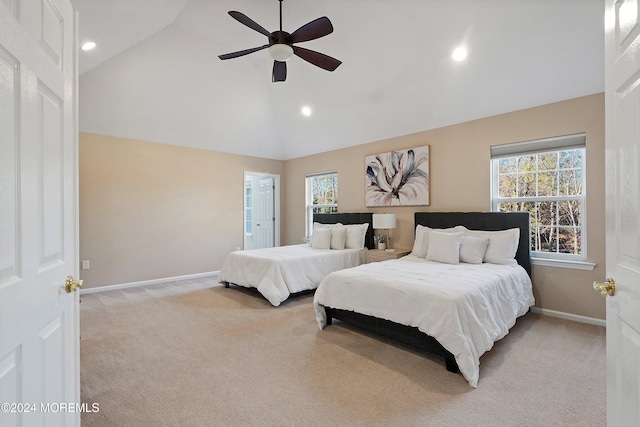 carpeted bedroom featuring ceiling fan and high vaulted ceiling