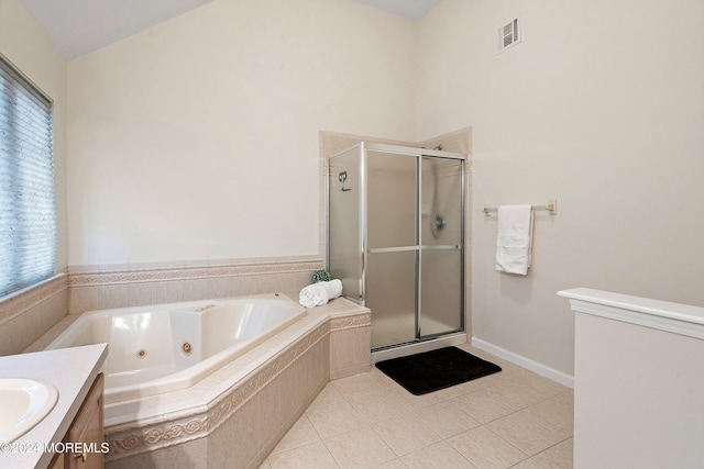 bathroom with tile patterned flooring, vanity, lofted ceiling, and shower with separate bathtub