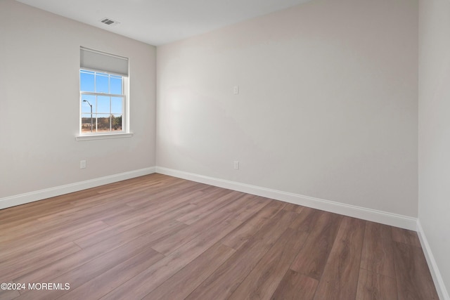 spare room with light wood-type flooring