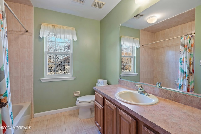 full bathroom featuring vanity, shower / bathtub combination with curtain, tile patterned floors, and a wealth of natural light