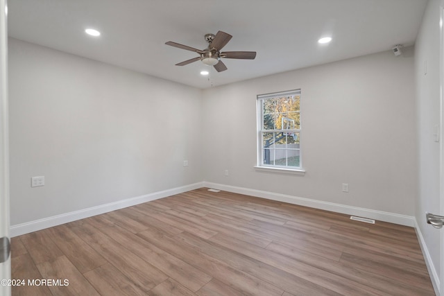 unfurnished room featuring ceiling fan and light hardwood / wood-style floors