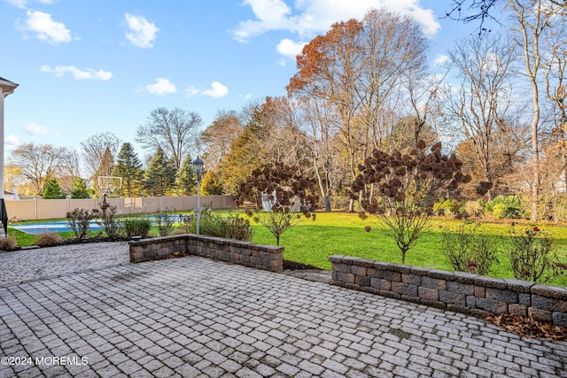 view of patio / terrace featuring basketball hoop