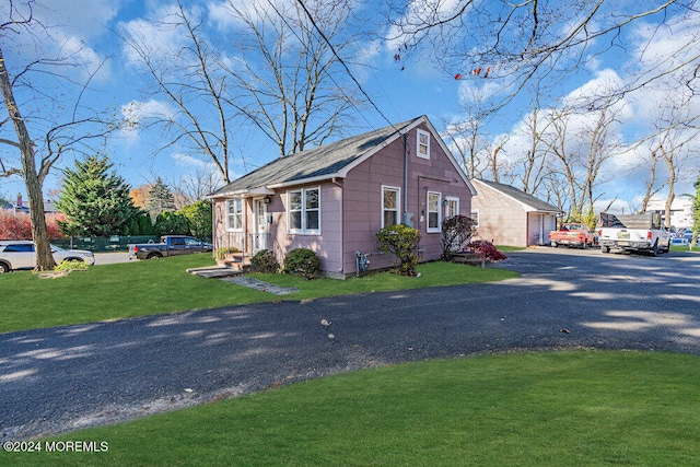 view of property exterior featuring a lawn