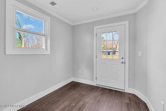 doorway to outside featuring ornamental molding and dark wood-type flooring