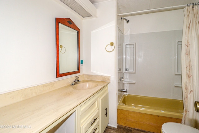 full bathroom with toilet, vanity, and shower / tub combo with curtain