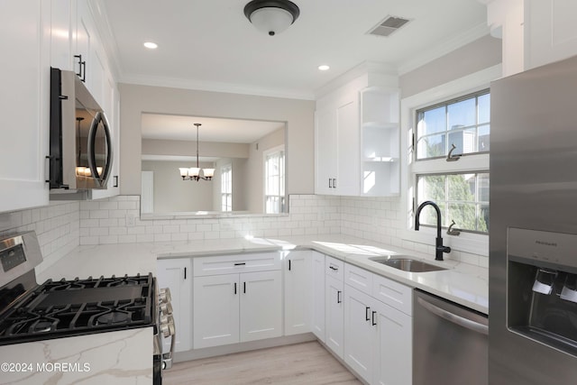 kitchen featuring white cabinetry, sink, and appliances with stainless steel finishes