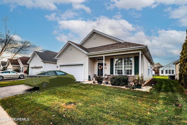 view of front facade featuring a garage and a front lawn