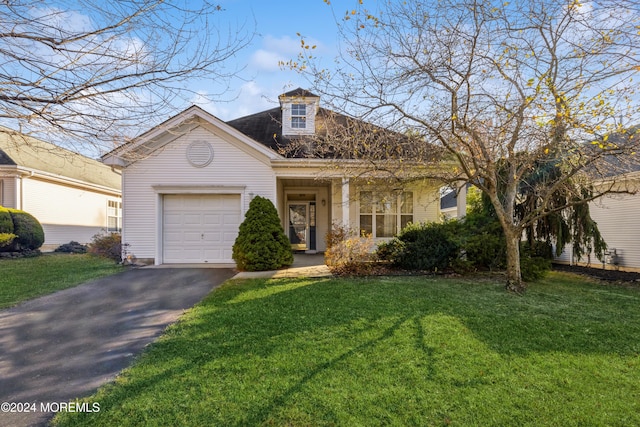 view of front facade featuring a garage and a front lawn