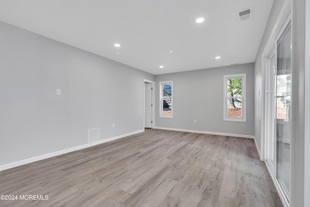 unfurnished room featuring light wood-type flooring