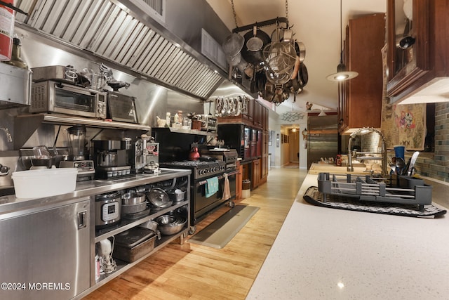 kitchen with stainless steel appliances and light hardwood / wood-style flooring