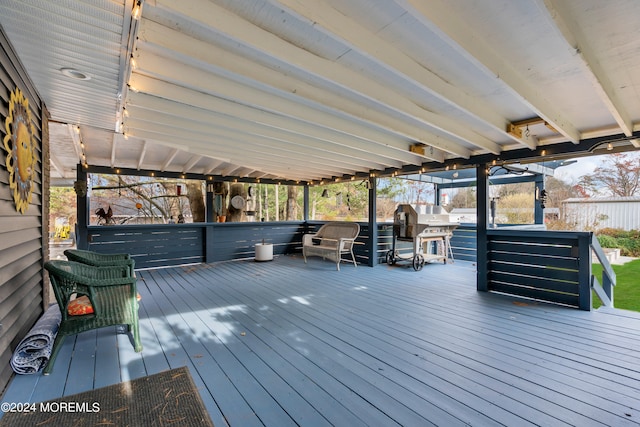 wooden terrace featuring grilling area