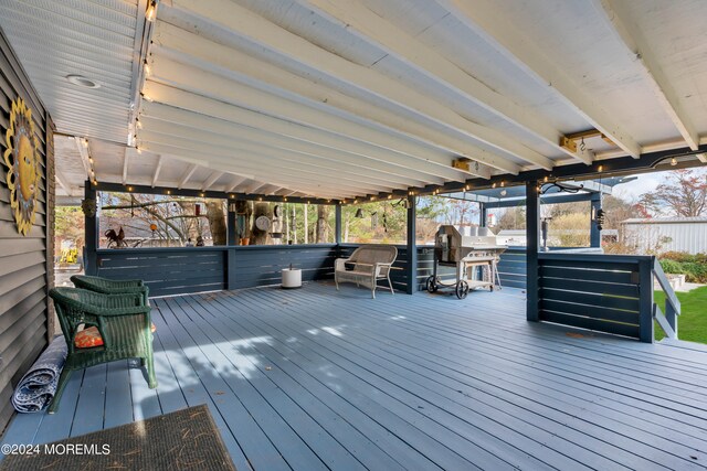 wooden deck with area for grilling