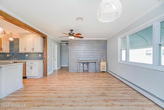 10 Inverell Dr, Toms River, NJ 08757 - kitchen featuring a baseboard heating unit, ornamental molding, light countertops, light wood finished floors, and ceiling fan
