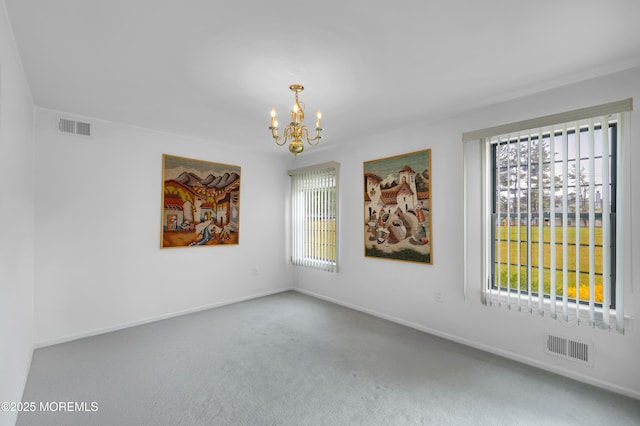 17 Suffolk Way, Marlboro, NJ 07746 - carpeted empty room featuring a chandelier and baseboards