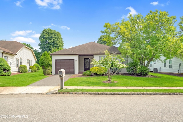 17 Suffolk Way, Marlboro, NJ 07746 - view of front of property with asphalt driveway, a garage, a front lawn, and central air condition unit