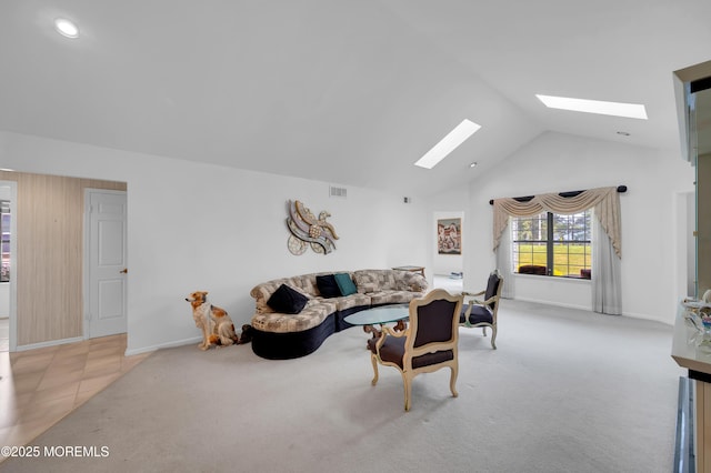 17 Suffolk Way, Marlboro, NJ 07746 - living area featuring a skylight, vaulted ceiling, baseboards, light carpet, and light tile patterned floors