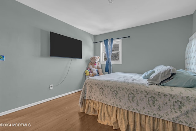 bedroom with wood-type flooring