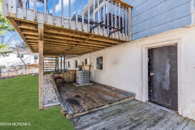 deck with a lawn and central AC