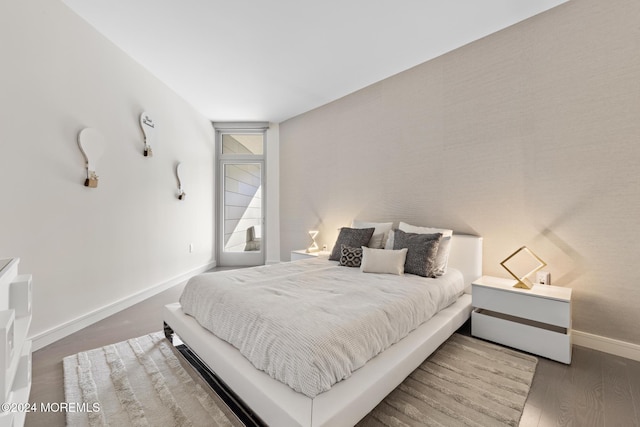 bedroom featuring dark wood-type flooring