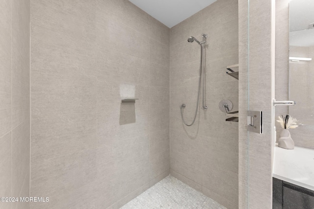 bathroom with a tile shower