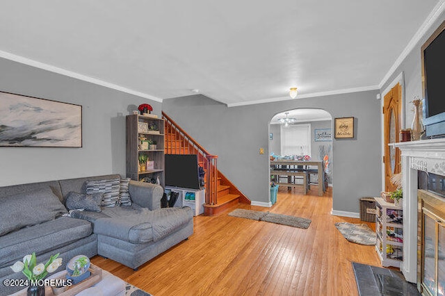 living room featuring hardwood / wood-style flooring and ornamental molding