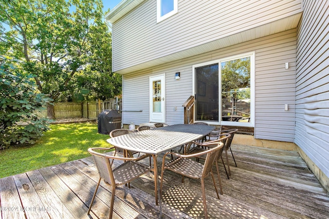 deck featuring a lawn