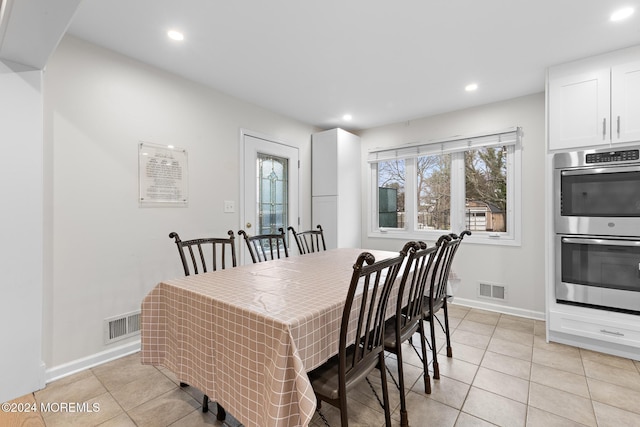 dining space with light tile patterned flooring