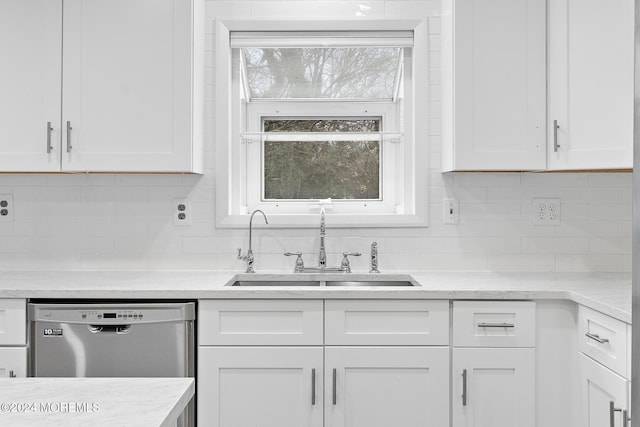 kitchen with backsplash, white cabinetry, sink, and dishwasher