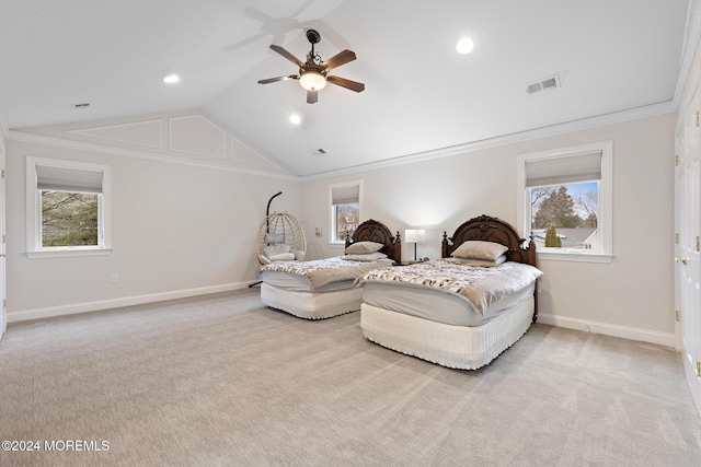 bedroom with ceiling fan, light colored carpet, ornamental molding, and multiple windows