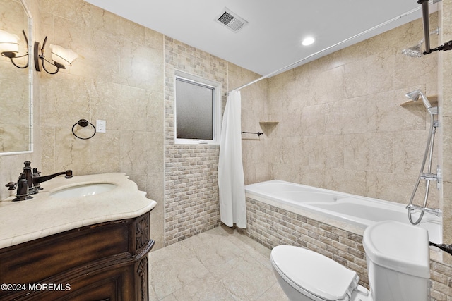 full bathroom featuring shower / tub combo with curtain, vanity, tile walls, and toilet