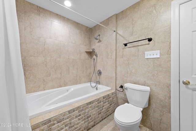 bathroom with shower / tub combo, toilet, and tile walls