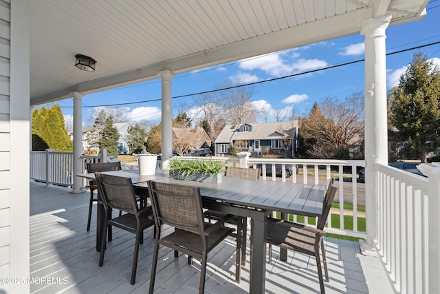 wooden deck featuring outdoor dining space