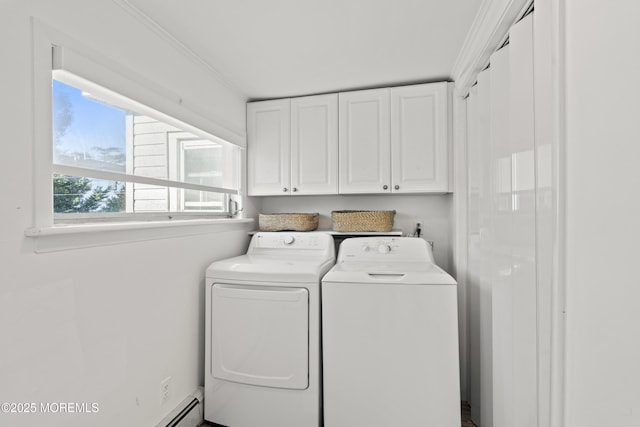 clothes washing area featuring washing machine and clothes dryer, cabinet space, and crown molding