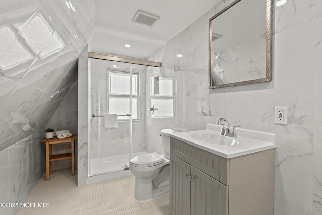 bathroom featuring a marble finish shower, visible vents, tile walls, and vanity