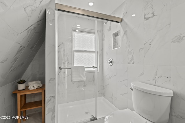 full bath featuring a marble finish shower and toilet