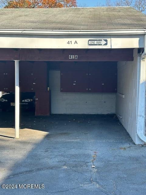 garage featuring a carport