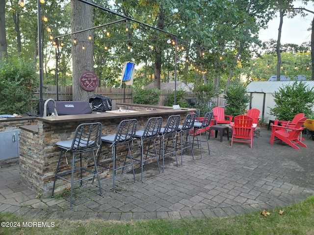 view of patio featuring a grill and an outdoor bar