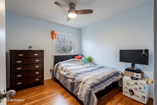 bedroom featuring ceiling fan and light hardwood / wood-style floors