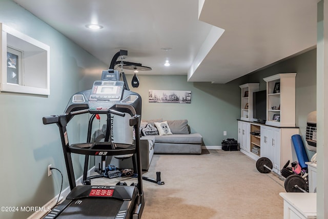 workout room with light colored carpet