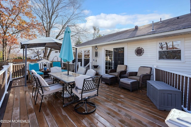 wooden terrace featuring an outdoor living space