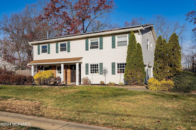 view of front of property with a front lawn and a porch