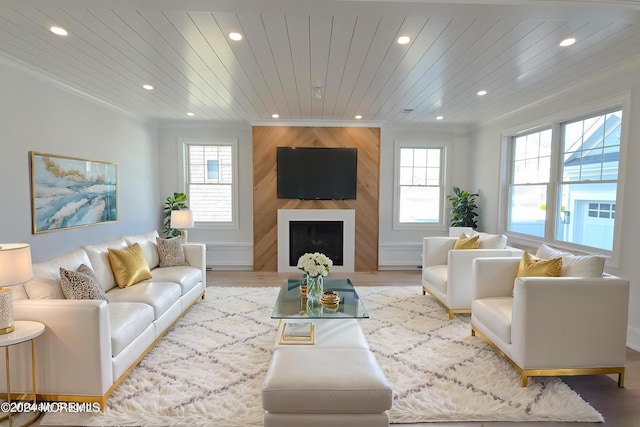 living room featuring a fireplace, light hardwood / wood-style floors, a wealth of natural light, and wood ceiling