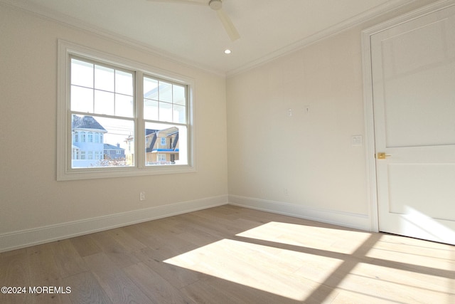 unfurnished room featuring hardwood / wood-style floors, ceiling fan, and ornamental molding