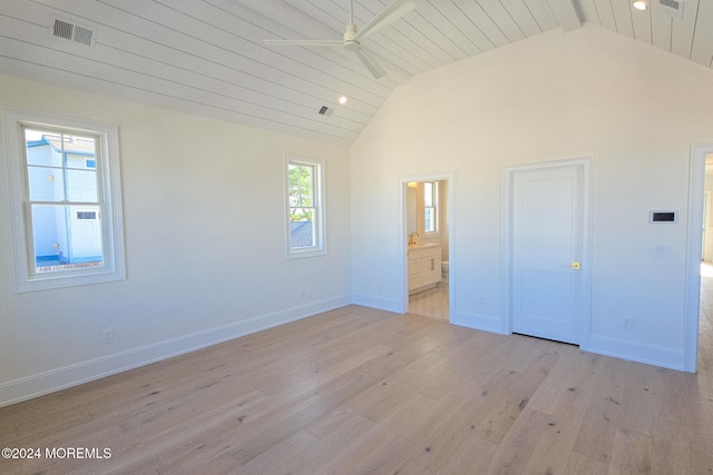 unfurnished bedroom featuring ceiling fan, wooden ceiling, vaulted ceiling with beams, ensuite bathroom, and light wood-type flooring