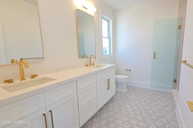 bathroom with vanity, toilet, and walk in shower