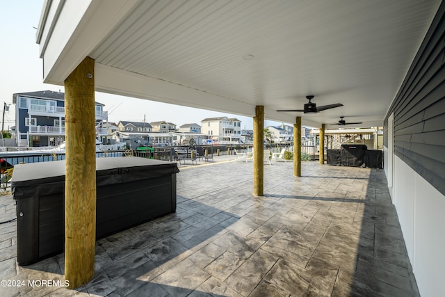 view of patio / terrace with a hot tub