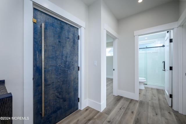 hallway featuring light hardwood / wood-style flooring