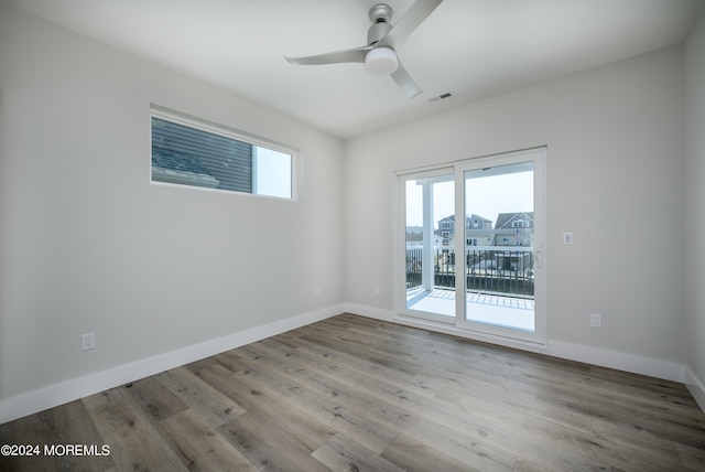 unfurnished room featuring ceiling fan and light hardwood / wood-style flooring